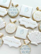 Load image into Gallery viewer, Coastal engagement cookie set with seashells and rings
