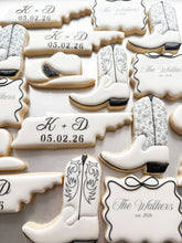 Load image into Gallery viewer, Western wedding cookies with Tennessee monogram, cowboy boots, hats, and The Walkers est. 2026 plaques
